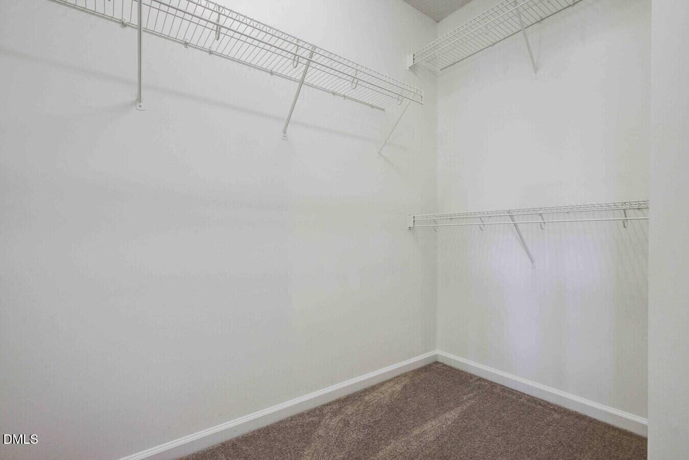 2101 Blackwolf Run Lane, Unit ST Raleigh, NC 27604 - Photo 29 of 30 a view of a room with racks on the wall