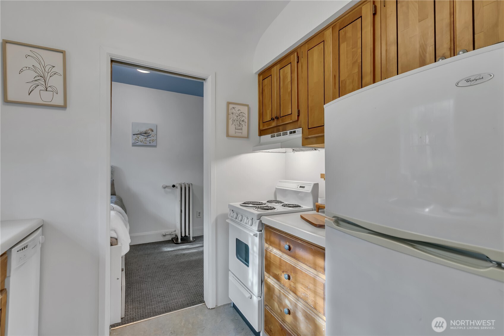 1101 17th Avenue, Unit 101 Seattle, WA 98122 - Photo 17 of 25 a kitchen with a stove and a microwave