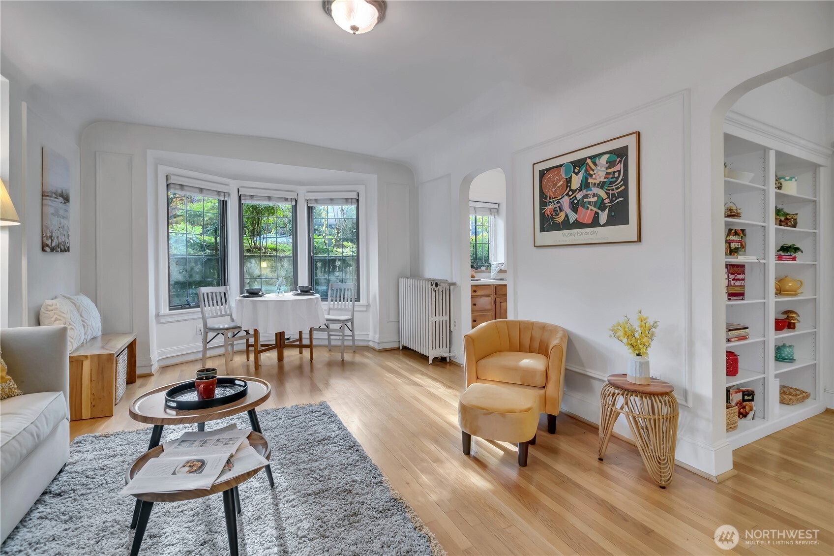 1101 17th Avenue, Unit 101 Seattle, WA 98122 - Photo 2 of 25 a living room with furniture and a window