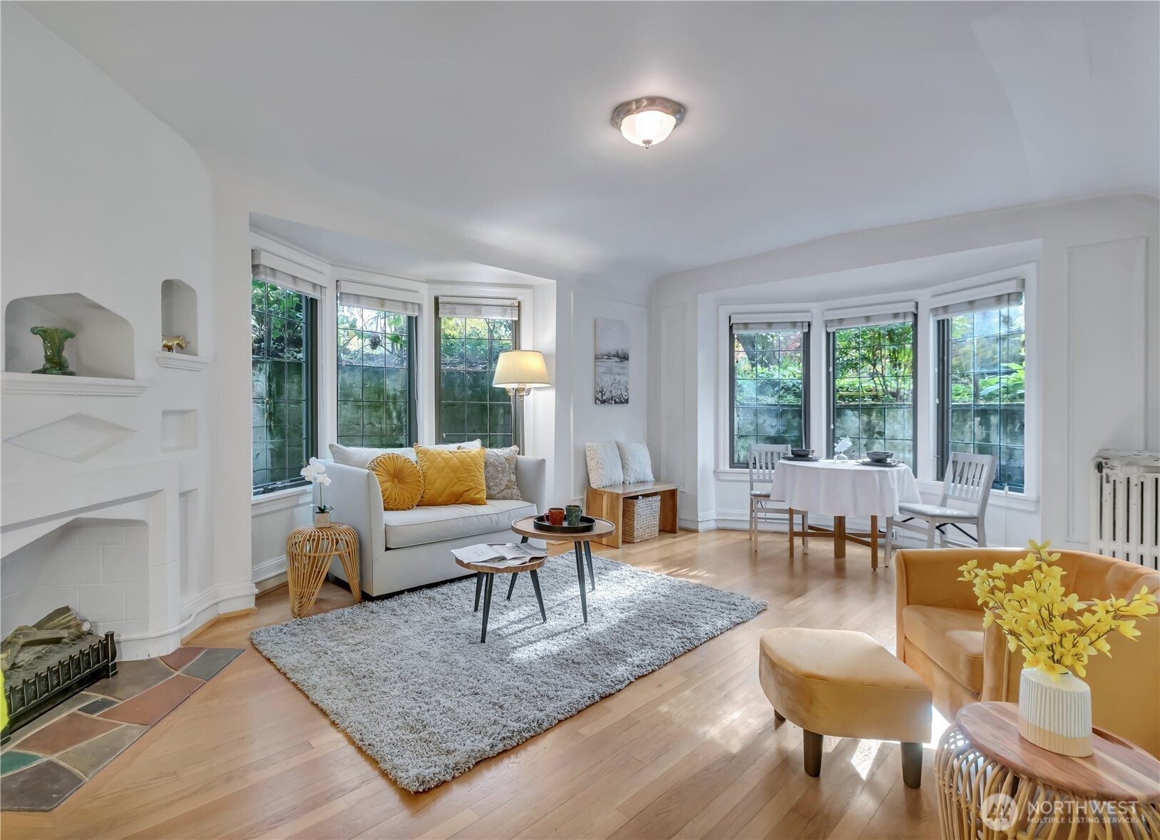 1101 17th Avenue, Unit 101 Seattle, WA 98122 - Photo 3 of 25 a living room with furniture and a large window