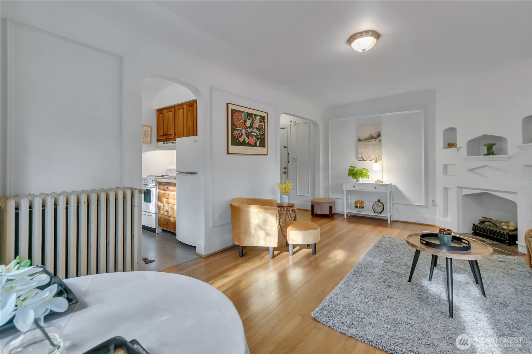 1101 17th Avenue, Unit 101 Seattle, WA 98122 - Photo 6 of 25 a living room with furniture and a fireplace