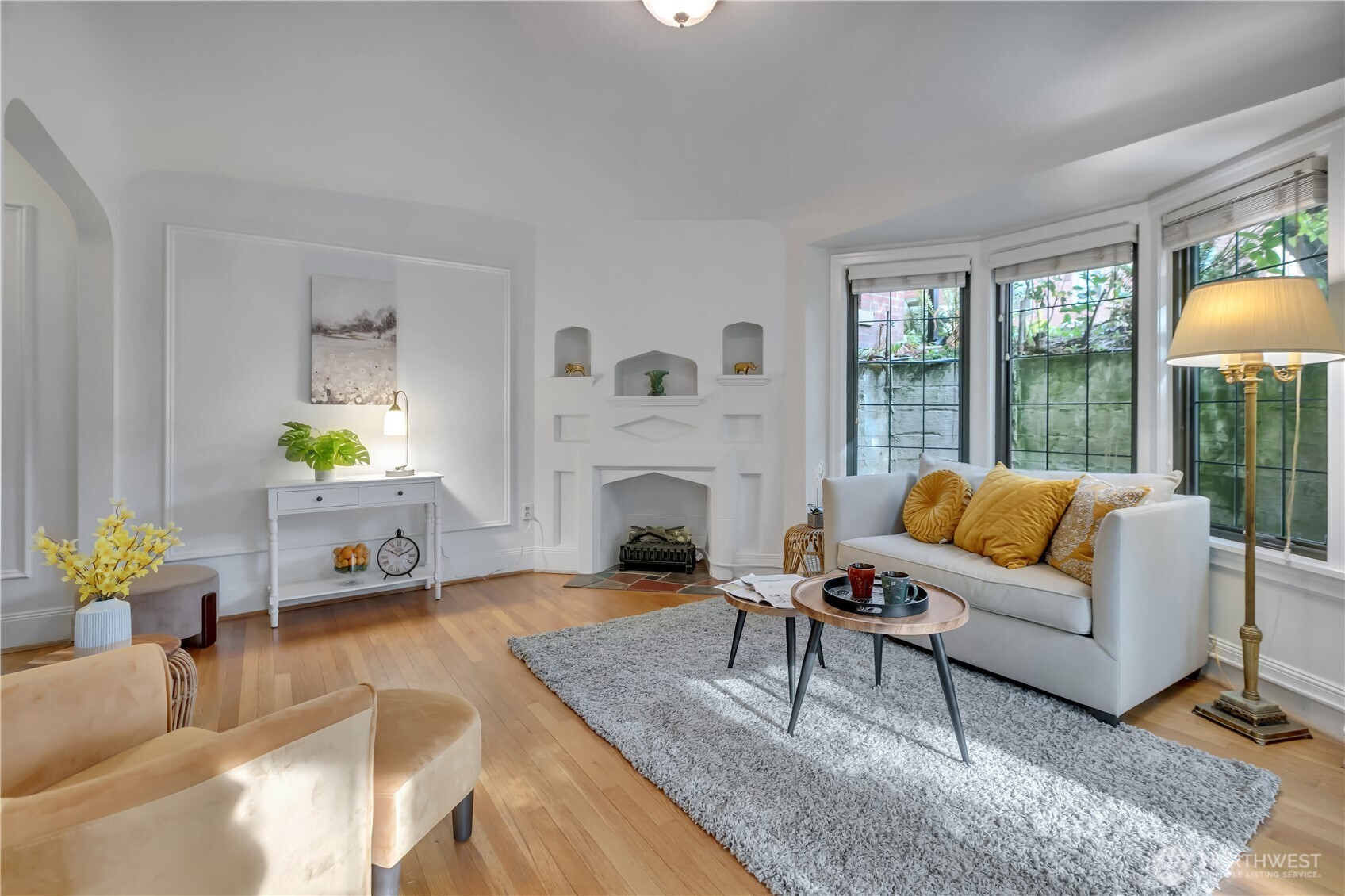 1101 17th Avenue, Unit 101 Seattle, WA 98122 - Photo 7 of 25 a living room with furniture and a fireplace