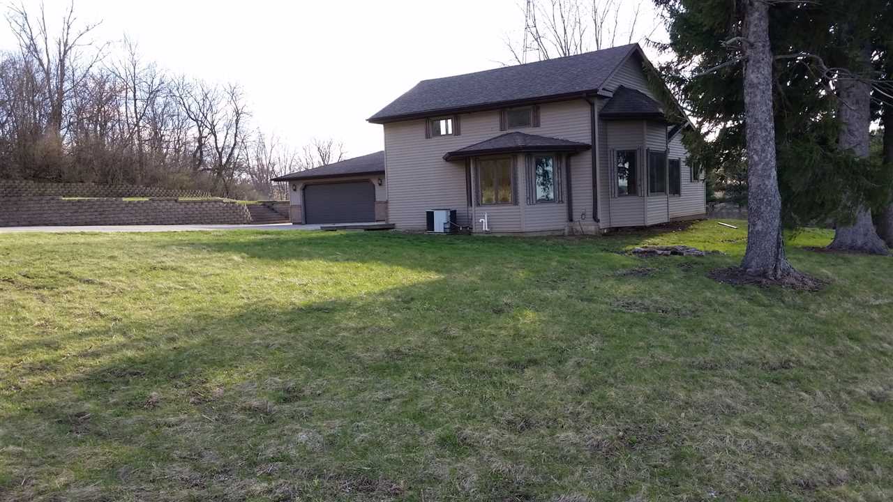 15946 East State Line Road Durand, IL 61024 - Photo 1 of 25 a view of a house with a yard