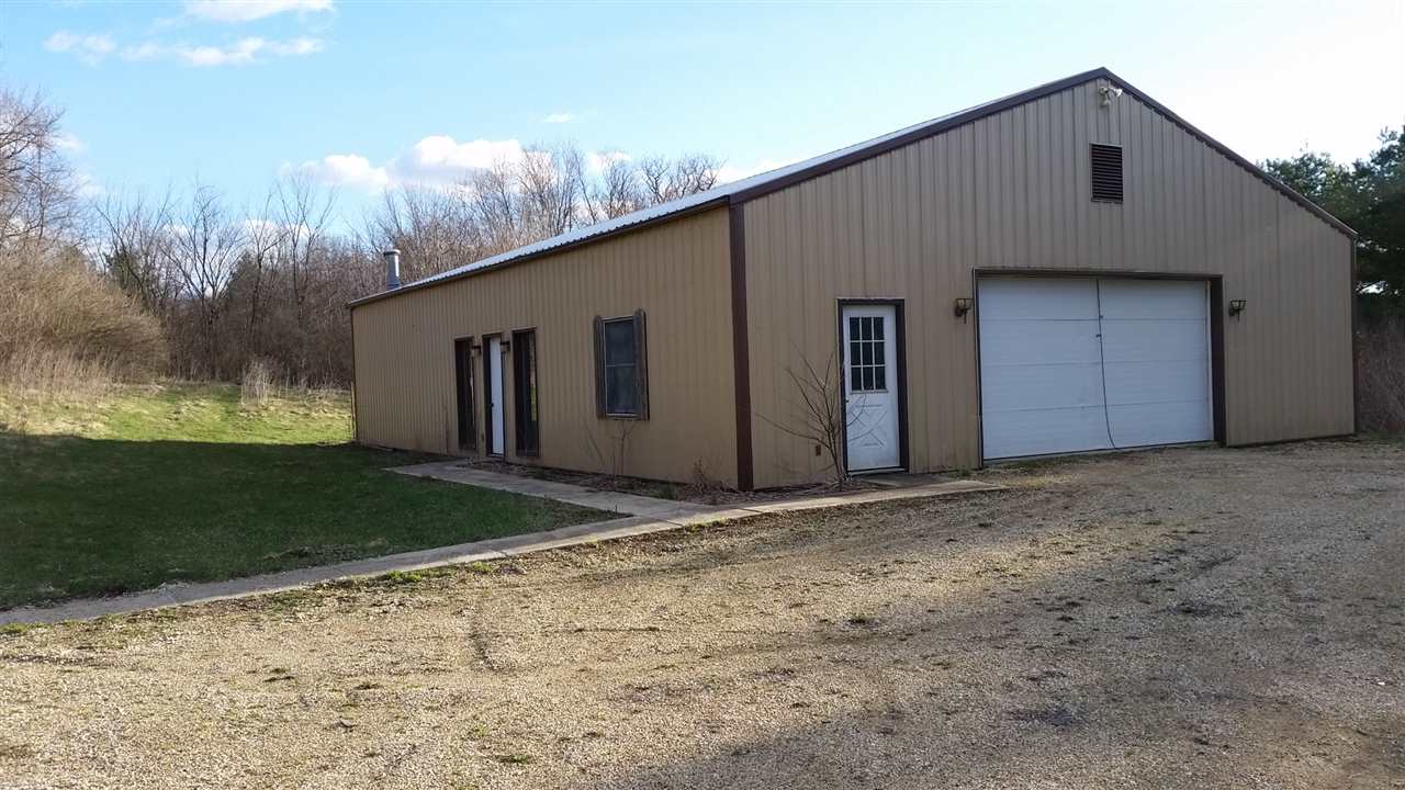 15946 East State Line Road Durand, IL 61024 - Photo 22 of 25 a house with yard