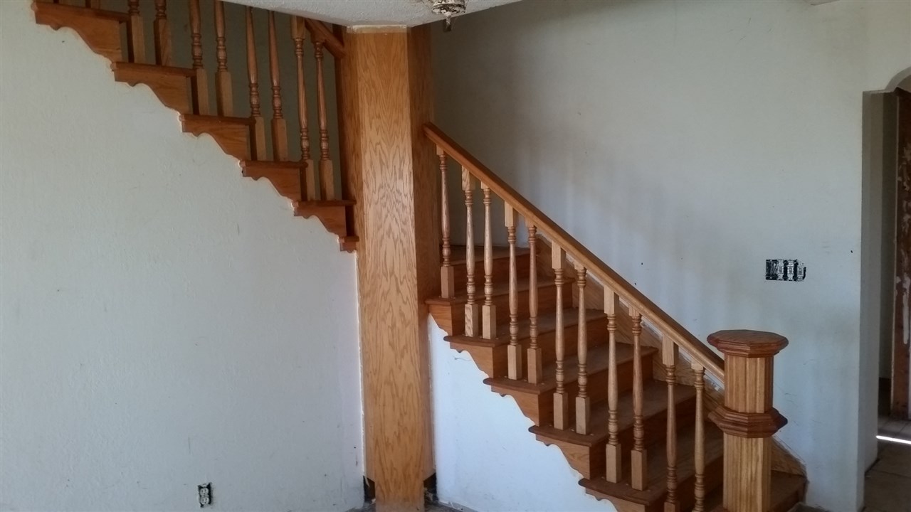 15946 East State Line Road Durand, IL 61024 - Photo 8 of 25 a view of staircase with wooden floor and white walls