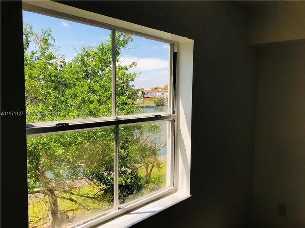 a view of a room with a large window