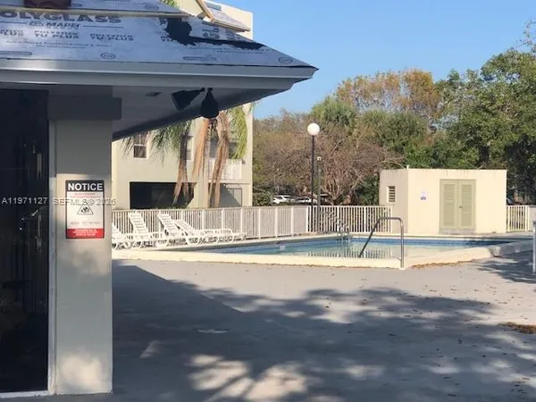 a view of swimming pool with a patio