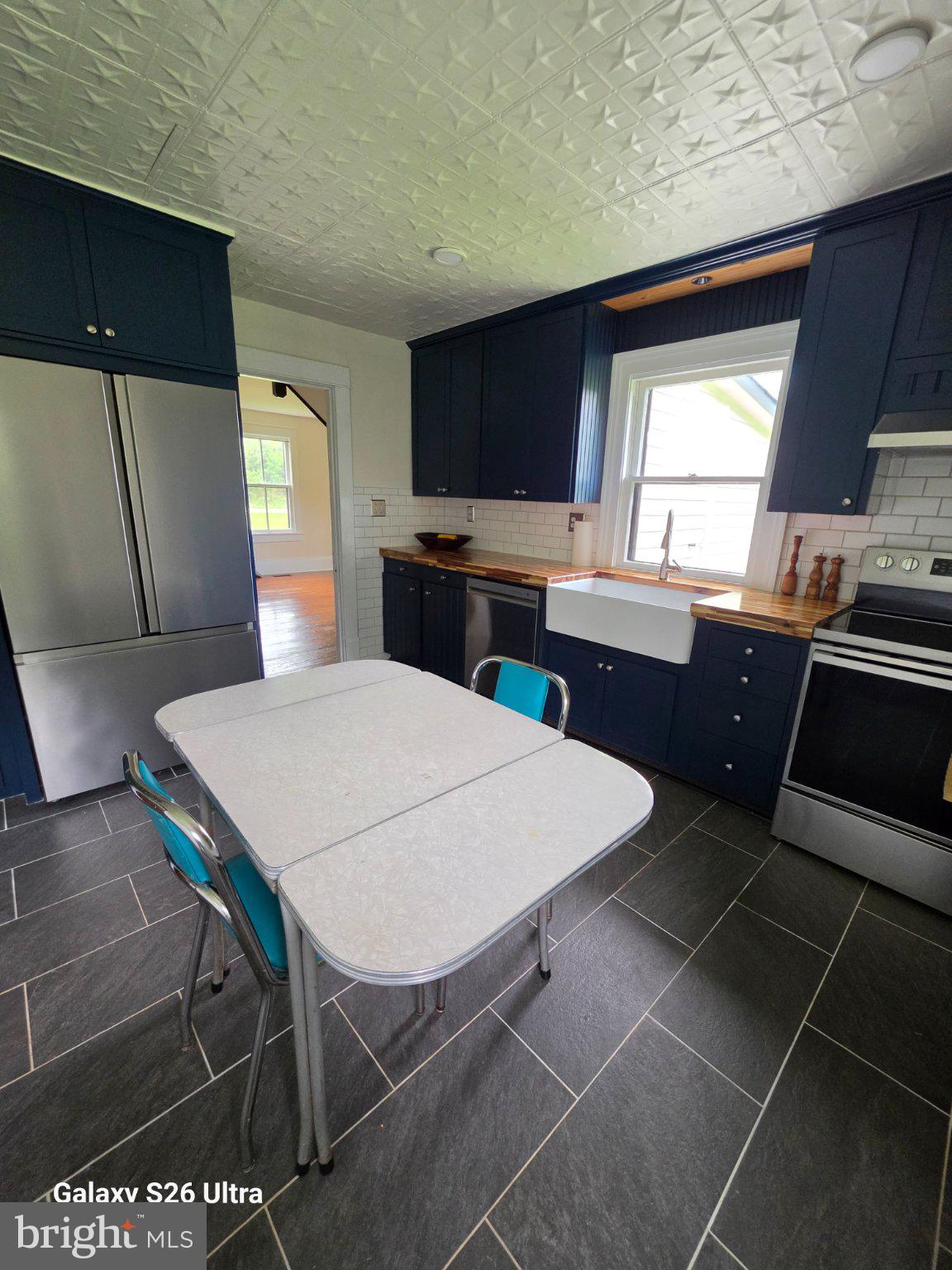22729 Rapidan Road Mitchells, VA 22729 - Photo 15 of 39 Charming kitchen with modern flair.