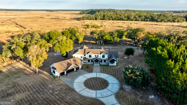 a view of a forest with a yard