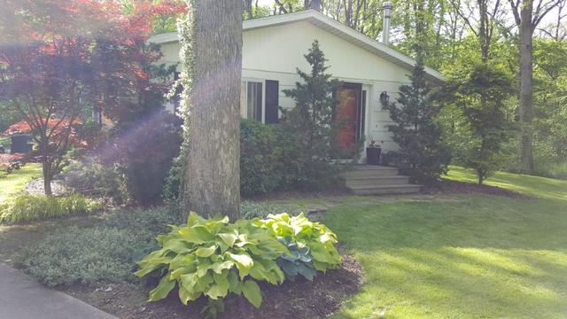 2052 North 3639th Road Serena, IL 60549 - Photo 1 of 15 a house with lots of trees