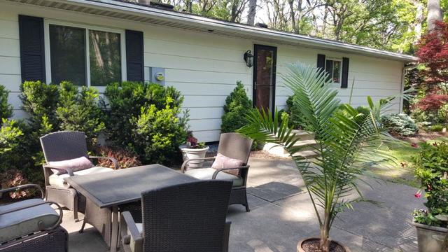 2052 North 3639th Road Serena, IL 60549 - Photo 13 of 15 a view of a patio with table and chairs and potted plants