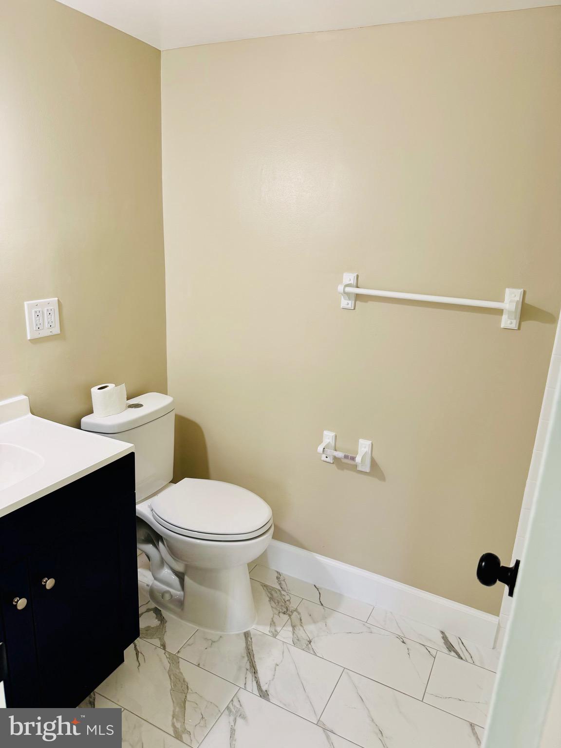 15712 Dorset Road, Unit 198 Laurel, MD 20707 - Photo 19 of 35 a bathroom with a toilet sink and vanity
