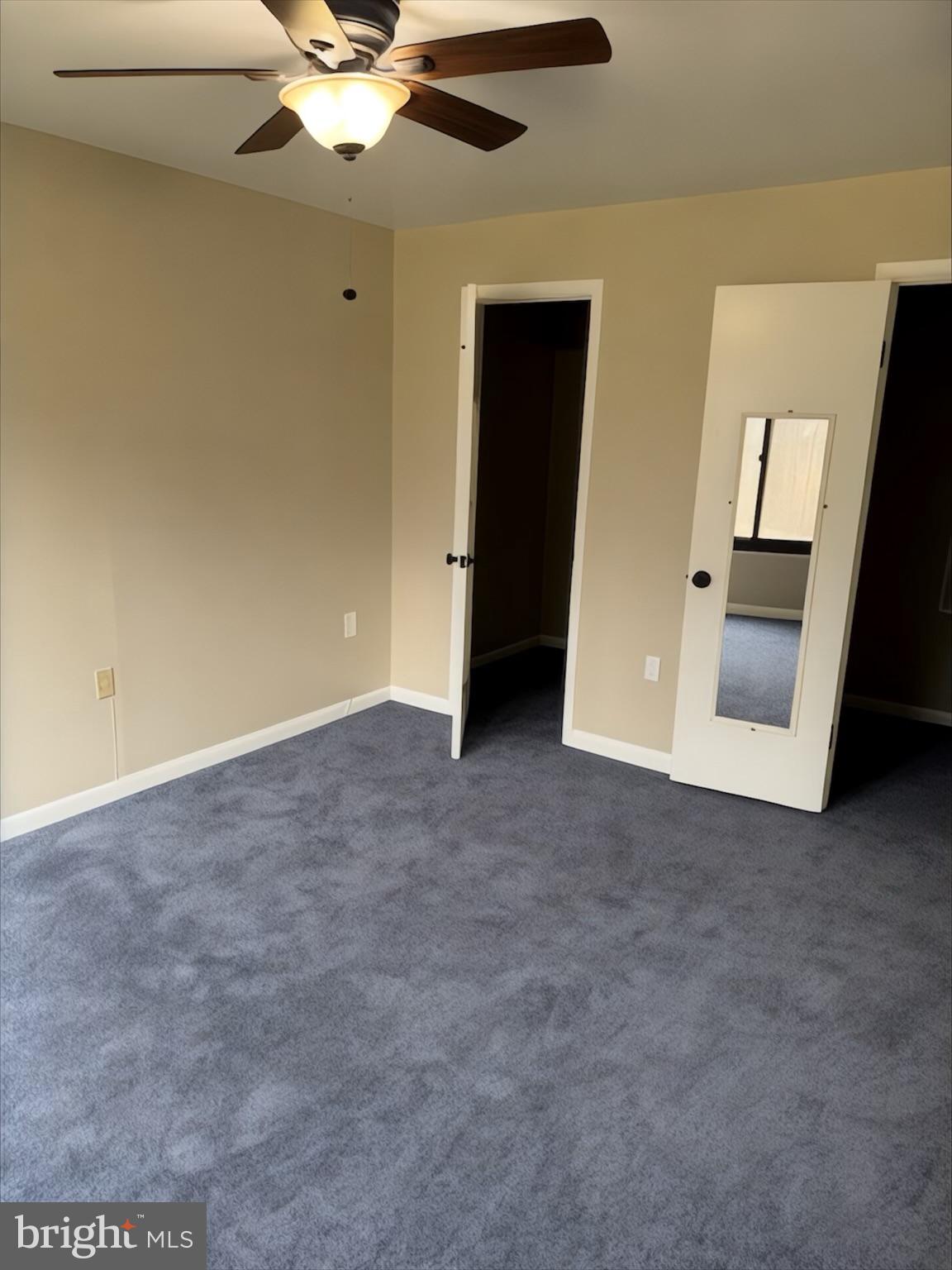 15712 Dorset Road, Unit 198 Laurel, MD 20707 - Photo 26 of 35 an empty room with closet and a chandelier fan