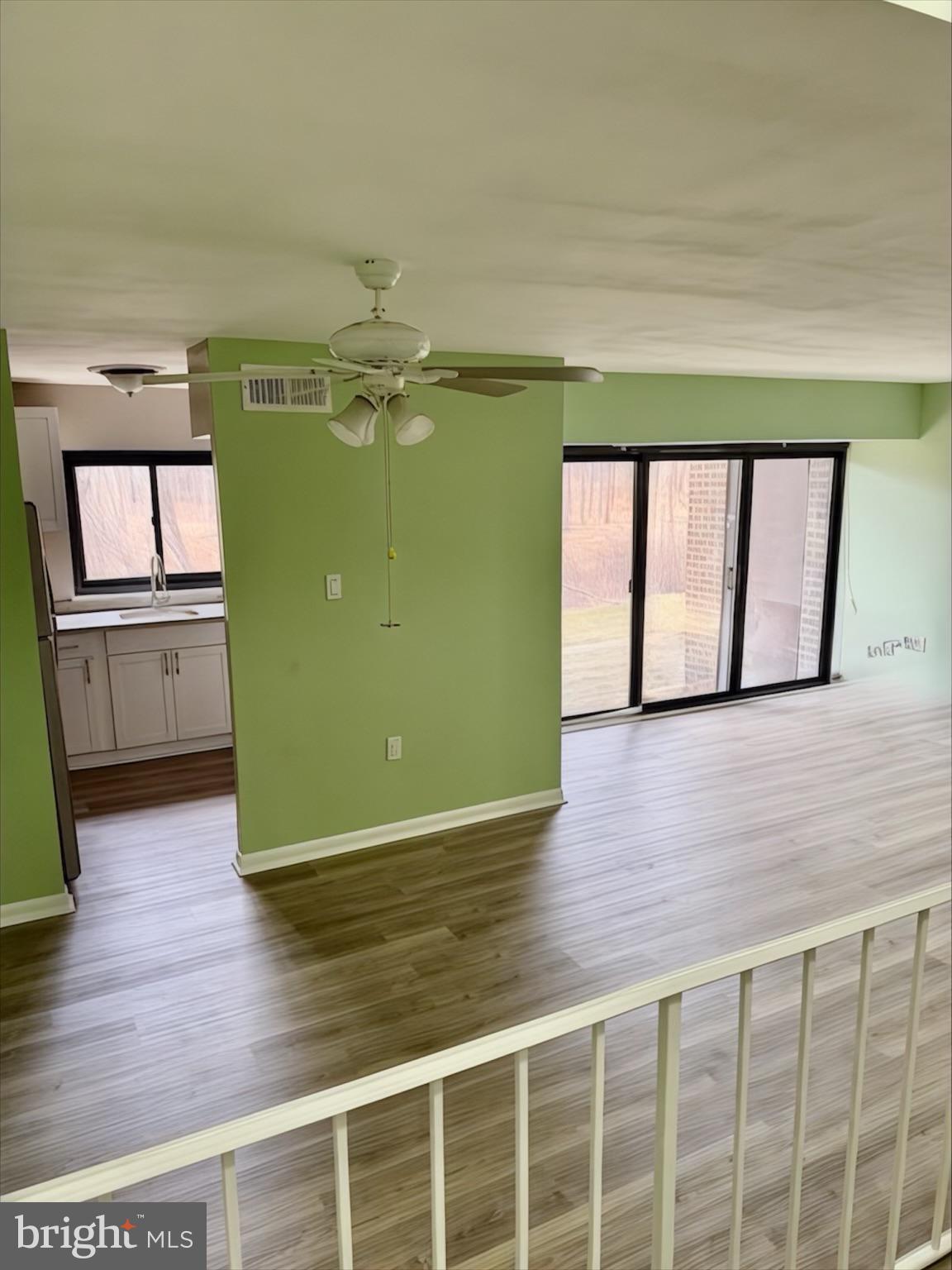 15712 Dorset Road, Unit 198 Laurel, MD 20707 - Photo 7 of 35 a view of a room with a large window and wooden floor