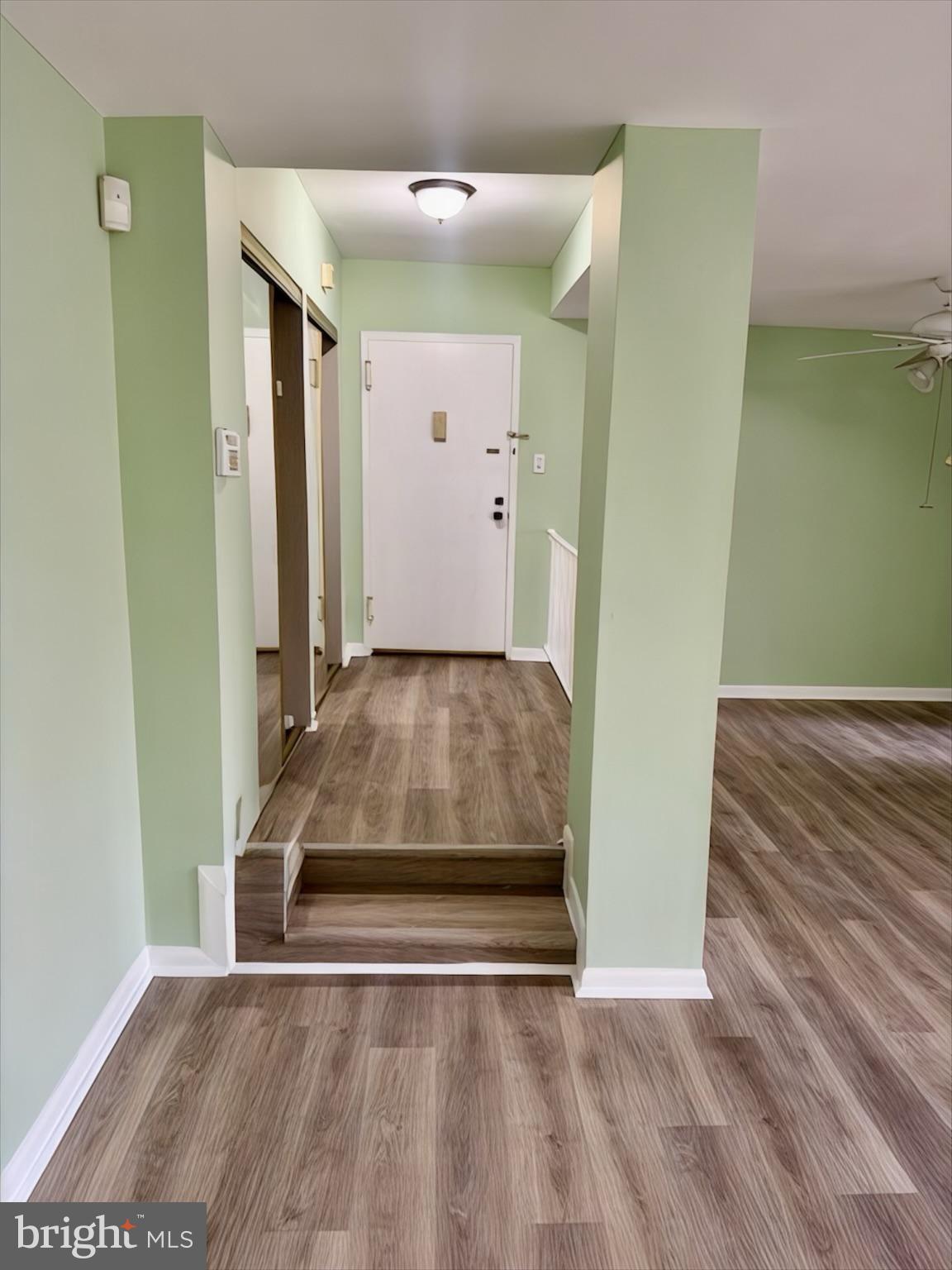 15712 Dorset Road, Unit 198 Laurel, MD 20707 - Photo 9 of 35 an empty room with wooden floor and a sink