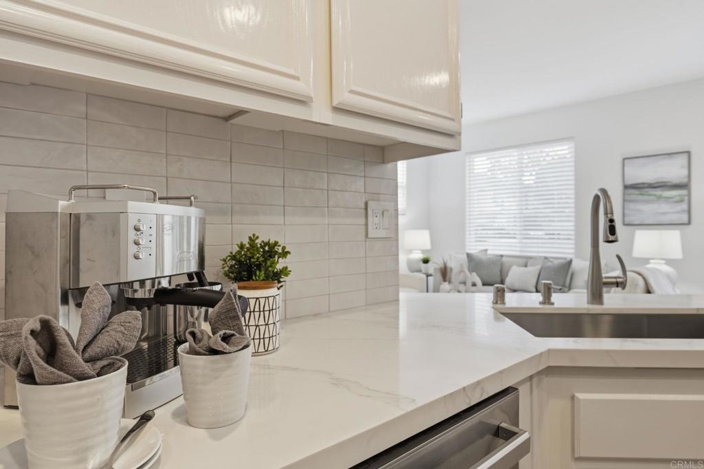 6180 Citracado Circle Carlsbad, CA 92009 - Photo 13 of 42 a kitchen with a sink and a refrigerator