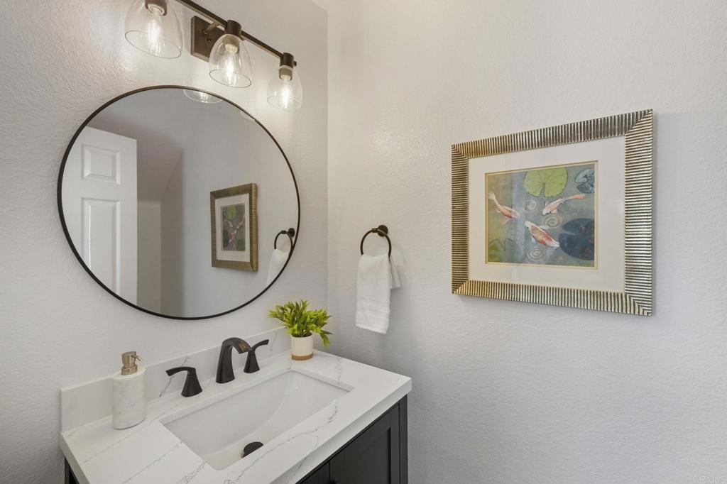 6180 Citracado Circle Carlsbad, CA 92009 - Photo 15 of 42 a bathroom with a sink and a mirror