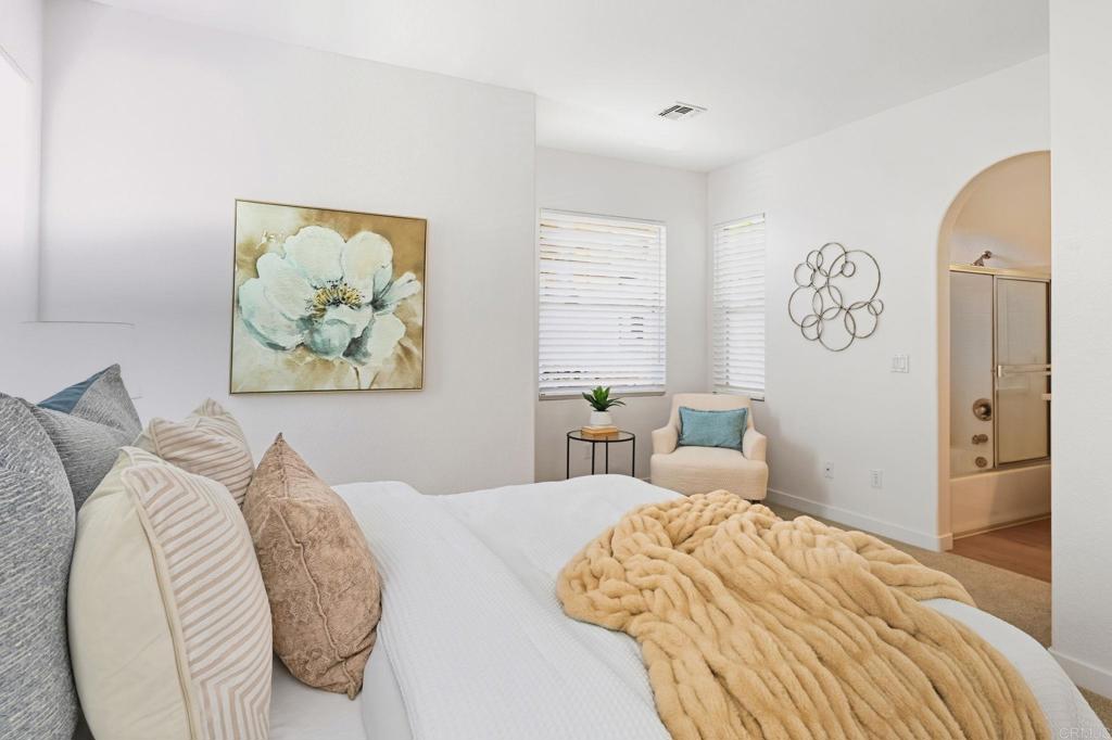 6180 Citracado Circle Carlsbad, CA 92009 - Photo 17 of 42 a bedroom with bed and a window