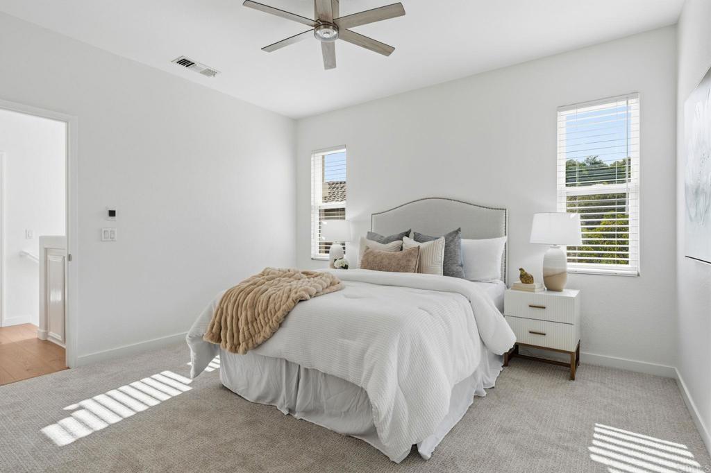 6180 Citracado Circle Carlsbad, CA 92009 - Photo 18 of 42 a bedroom with a bed and a window