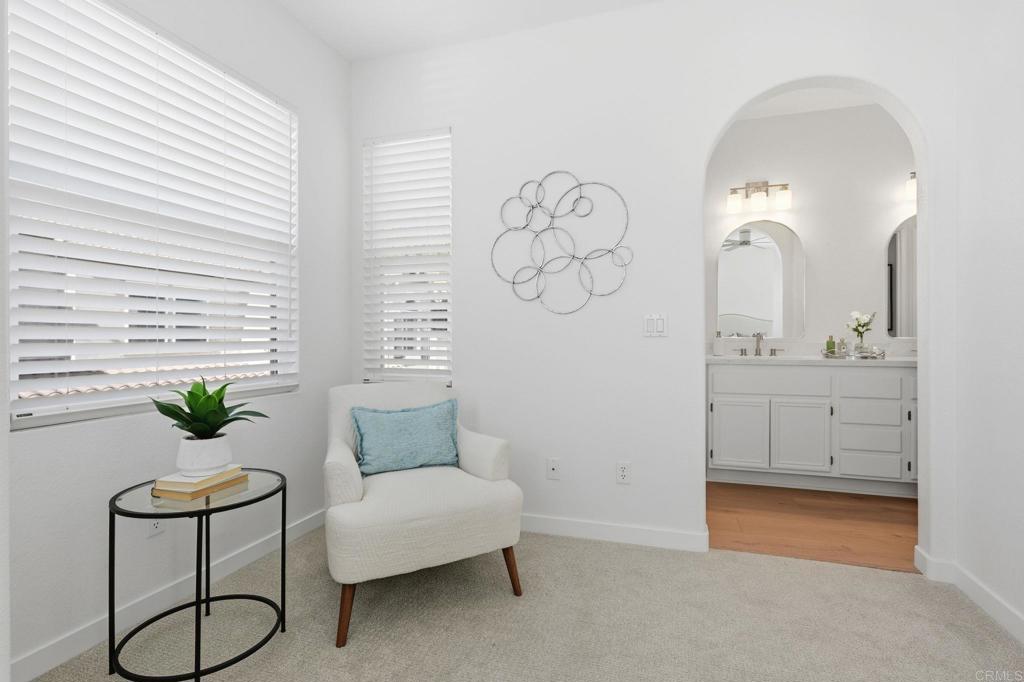 6180 Citracado Circle Carlsbad, CA 92009 - Photo 19 of 42 a en suite bathroom with a granite countertop sink and a mirror