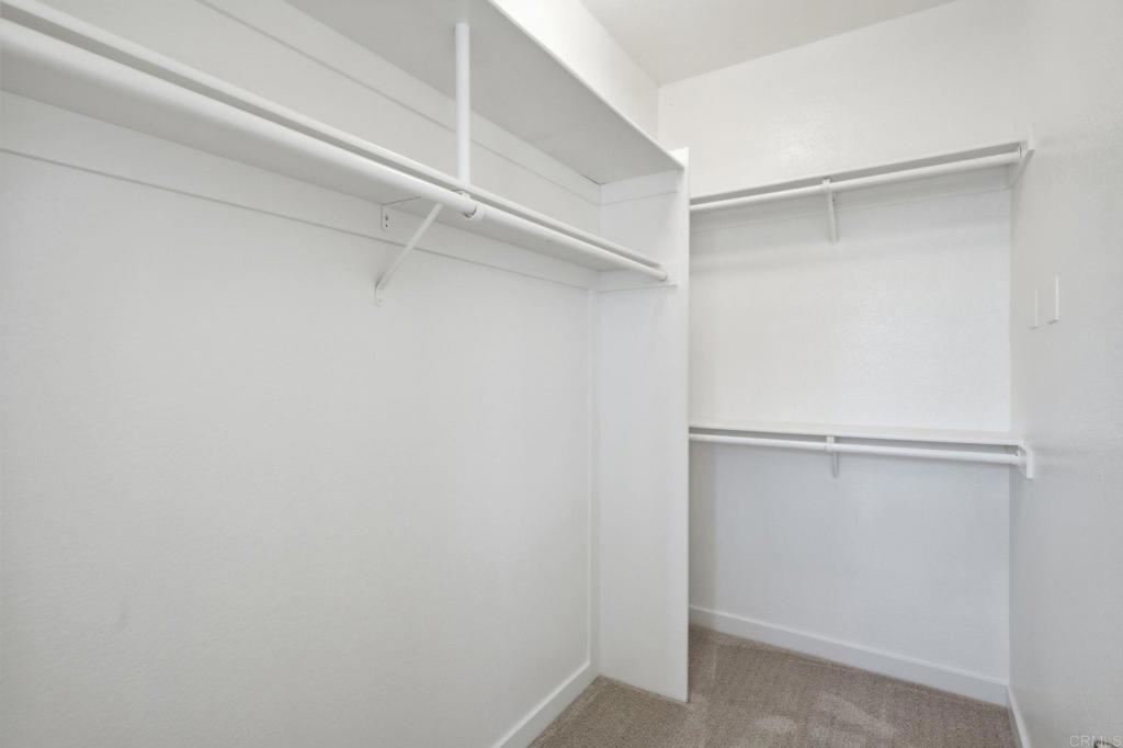 6180 Citracado Circle Carlsbad, CA 92009 - Photo 23 of 42 a view of an empty walk in closet