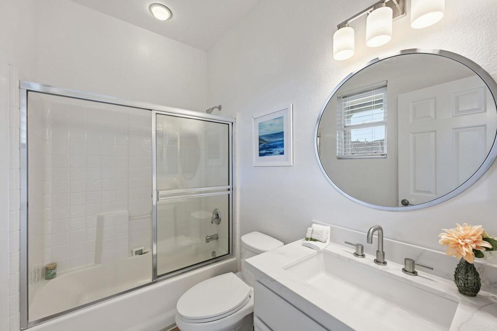 6180 Citracado Circle Carlsbad, CA 92009 - Photo 26 of 42 a bathroom with a sink a toilet and shower
