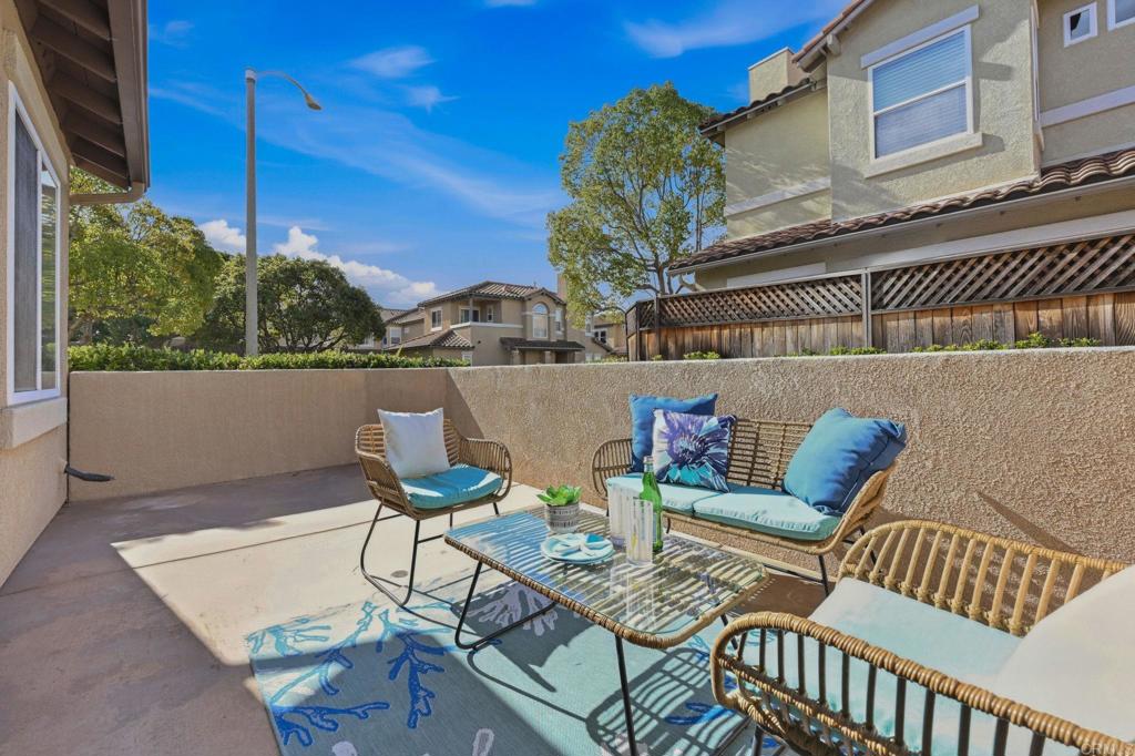6180 Citracado Circle Carlsbad, CA 92009 - Photo 29 of 42 a view of a patio with couches table and chairs