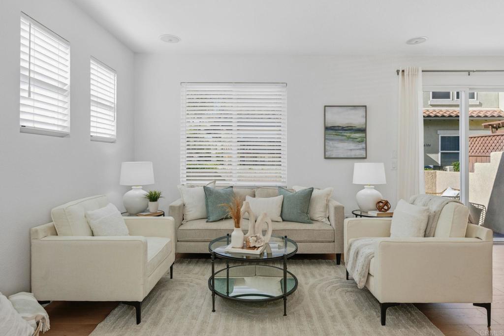6180 Citracado Circle Carlsbad, CA 92009 - Photo 3 of 42 a living room with furniture and windows