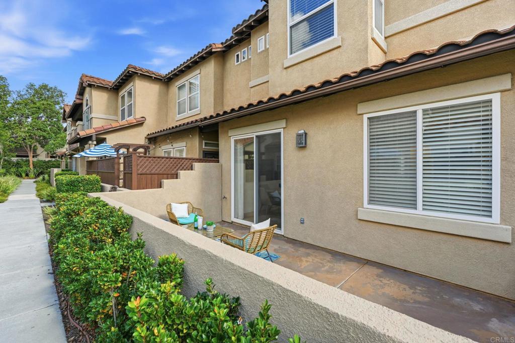 6180 Citracado Circle Carlsbad, CA 92009 - Photo 31 of 42 a front view of a house with garden