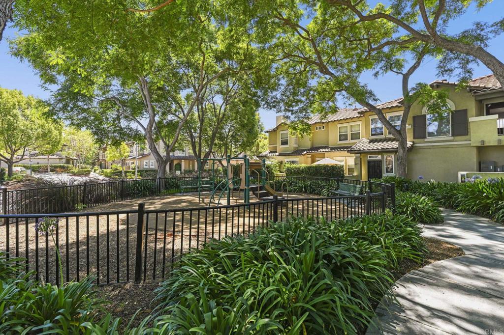 6180 Citracado Circle Carlsbad, CA 92009 - Photo 37 of 42 a view of a street with a small yard
