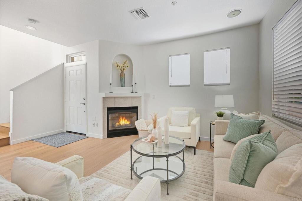 6180 Citracado Circle Carlsbad, CA 92009 - Photo 5 of 42 a living room with furniture and a fireplace