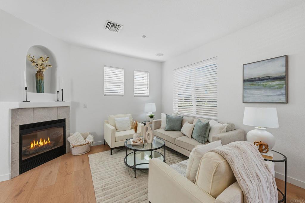 6180 Citracado Circle Carlsbad, CA 92009 - Photo 6 of 42 a living room with furniture and a fireplace