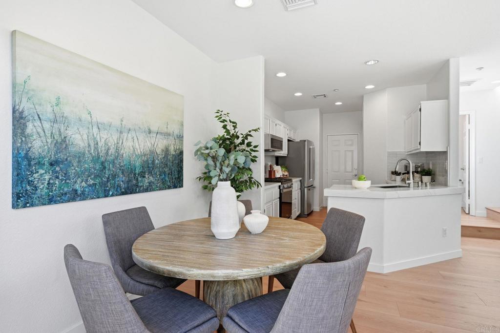 6180 Citracado Circle Carlsbad, CA 92009 - Photo 8 of 42 a view of a dining room with furniture window and wooden floor