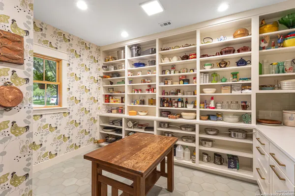 a view of a bedroom with shelves
