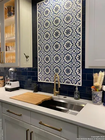 a view of sink with mirror