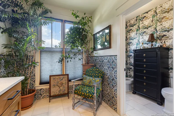 a view of a entryway with a bench and fire pit