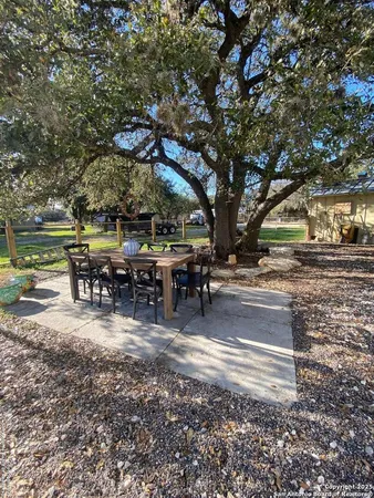 a view of a yard with patio