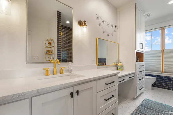 a bathroom with a double vanity sink mirror and double