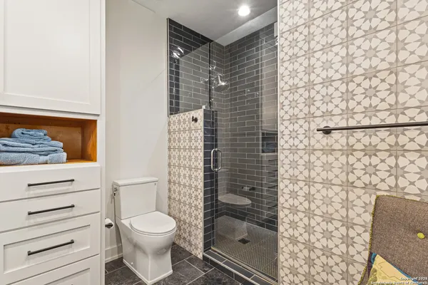 a bedroom with a bed a table and chair