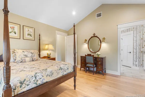 a bathroom with a shower and a sink