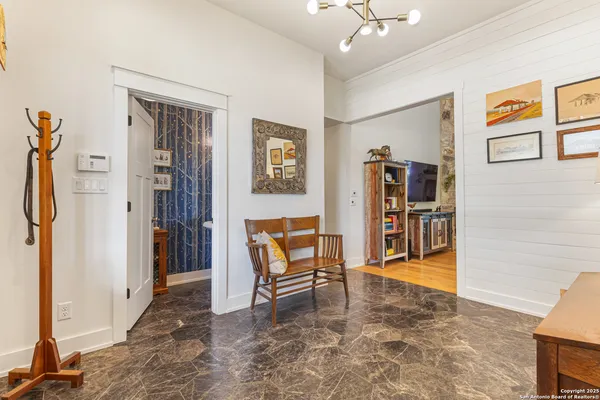 a living room with furniture and a rug