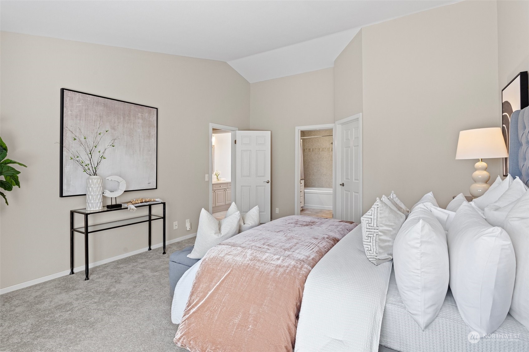 112 236th Place Southwest Bothell, WA 98021 - Photo 16 of 40 a spacious bedroom with a bed and a lamp on dresser