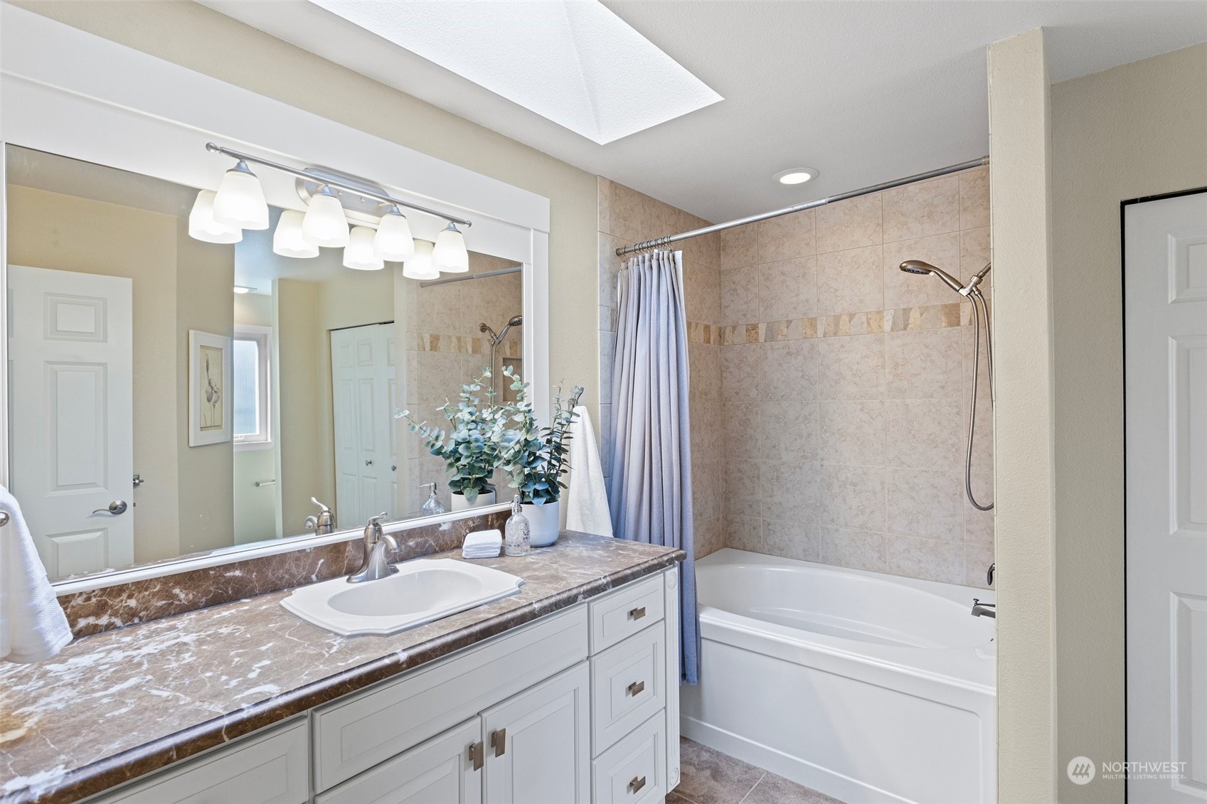 112 236th Place Southwest Bothell, WA 98021 - Photo 17 of 40 a bathroom with a granite countertop sink mirror and a shower