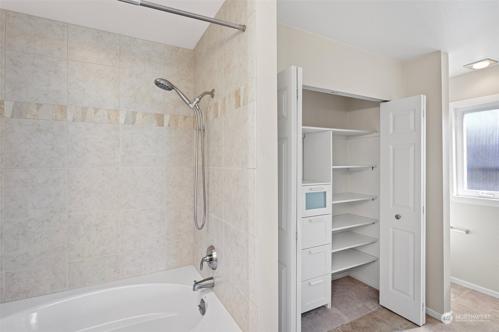112 236th Place Southwest Bothell, WA 98021 - Photo 18 of 40 a bathroom with a bathtub and a shower