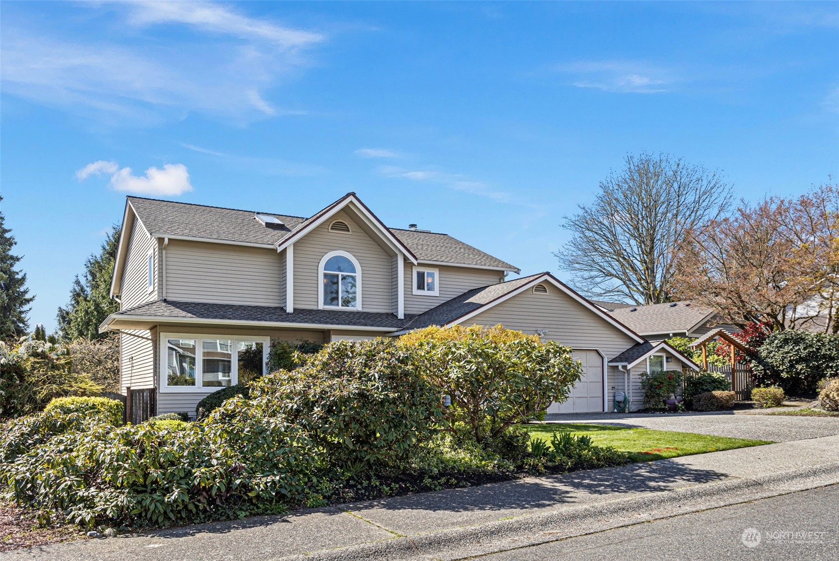 112 236th Place Southwest Bothell, WA 98021 - Photo 2 of 40 a view of a house with a yard and large trees