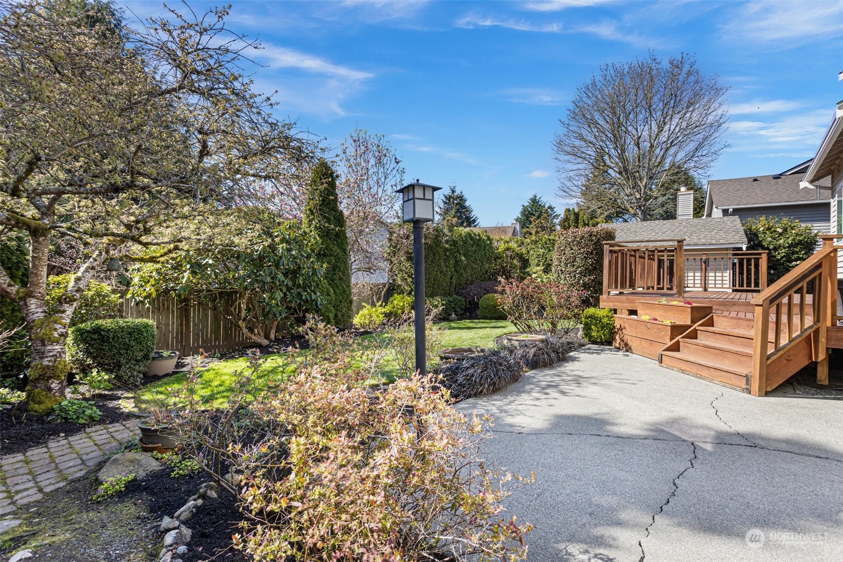 112 236th Place Southwest Bothell, WA 98021 - Photo 30 of 40 a view of a house with backyard and trees