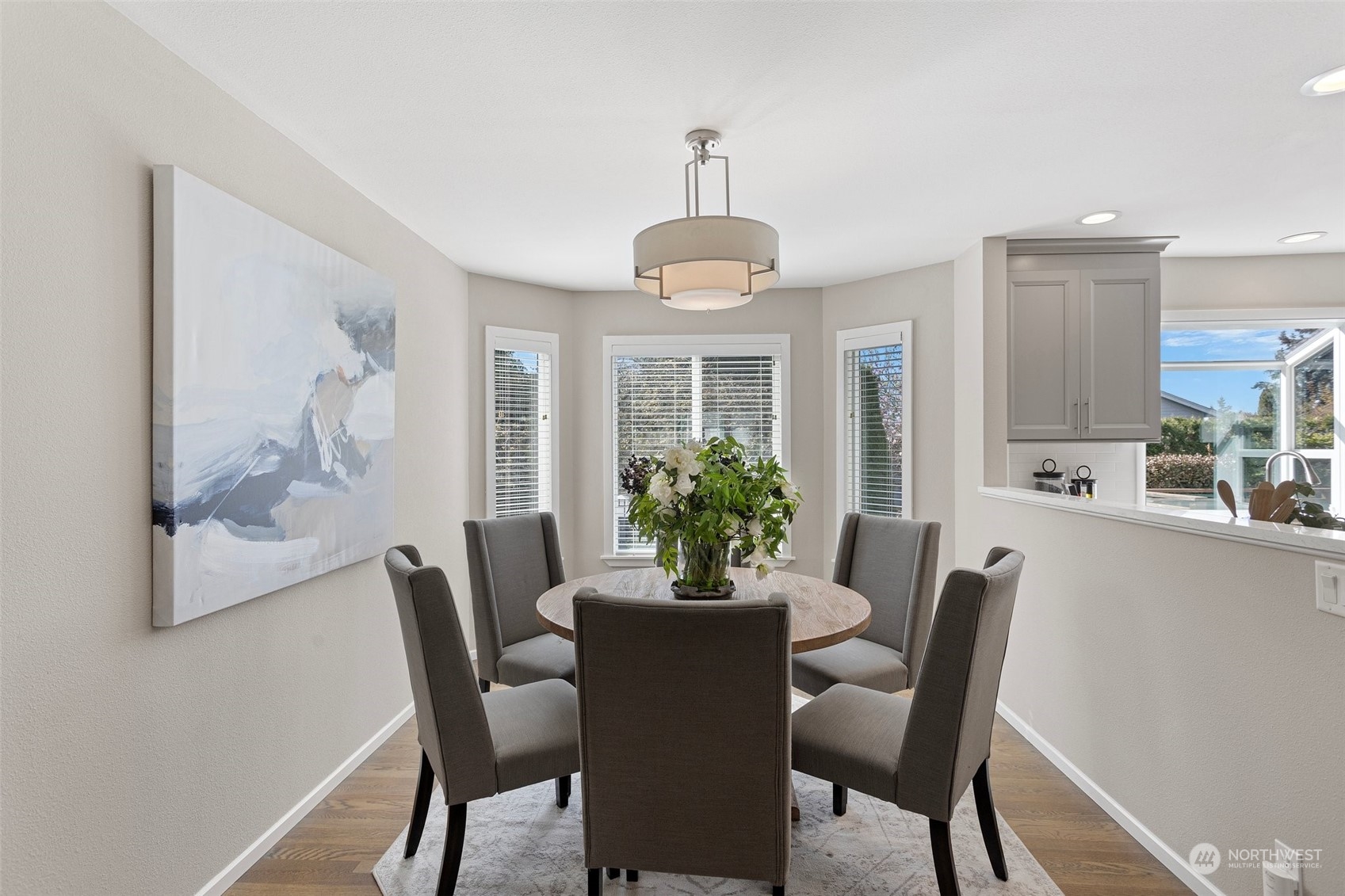 112 236th Place Southwest Bothell, WA 98021 - Photo 7 of 40 a dining room with furniture potted plants and wooden floor