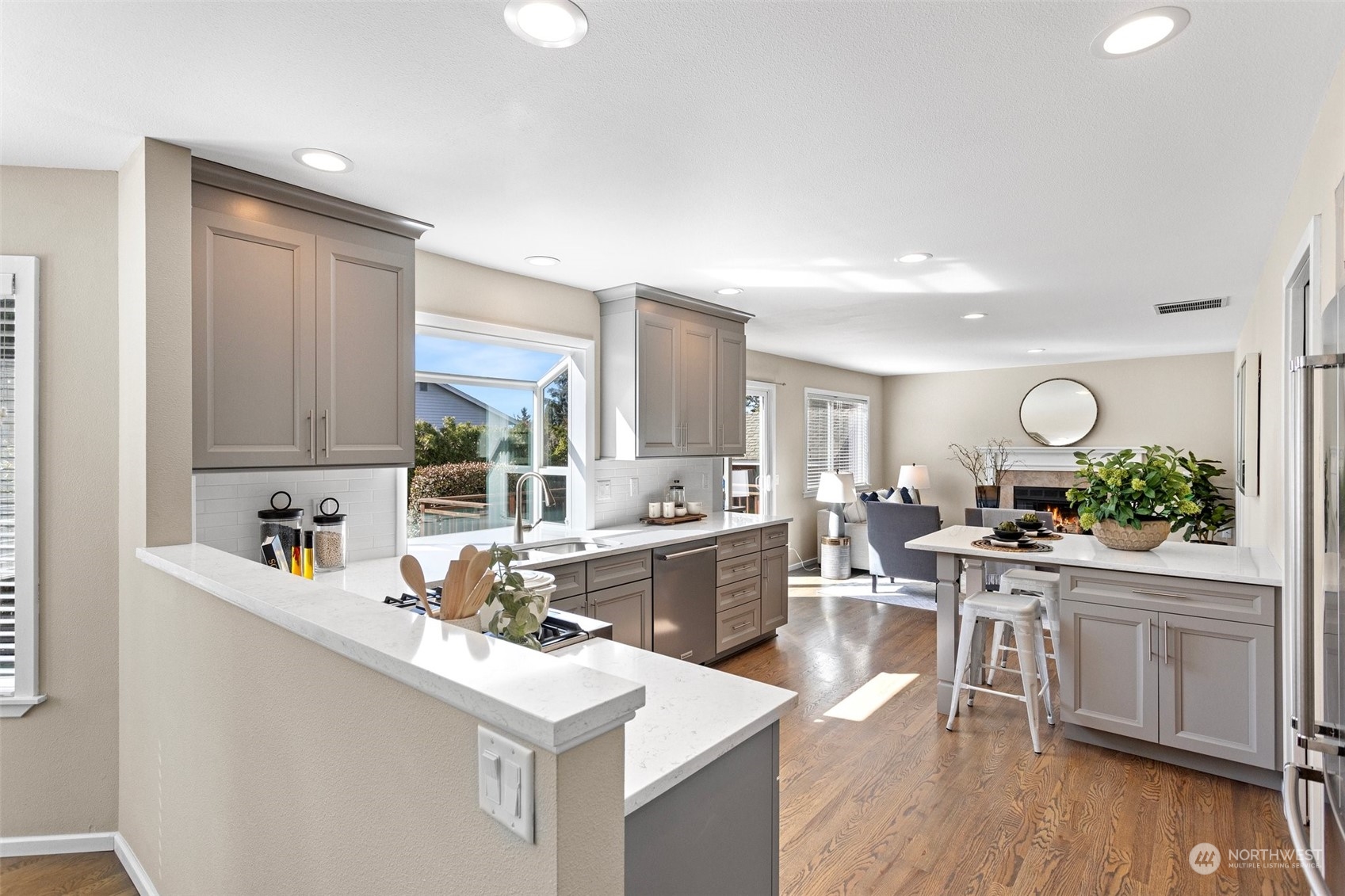 112 236th Place Southwest Bothell, WA 98021 - Photo 8 of 40 a kitchen with a sink stove and wooden cabinets