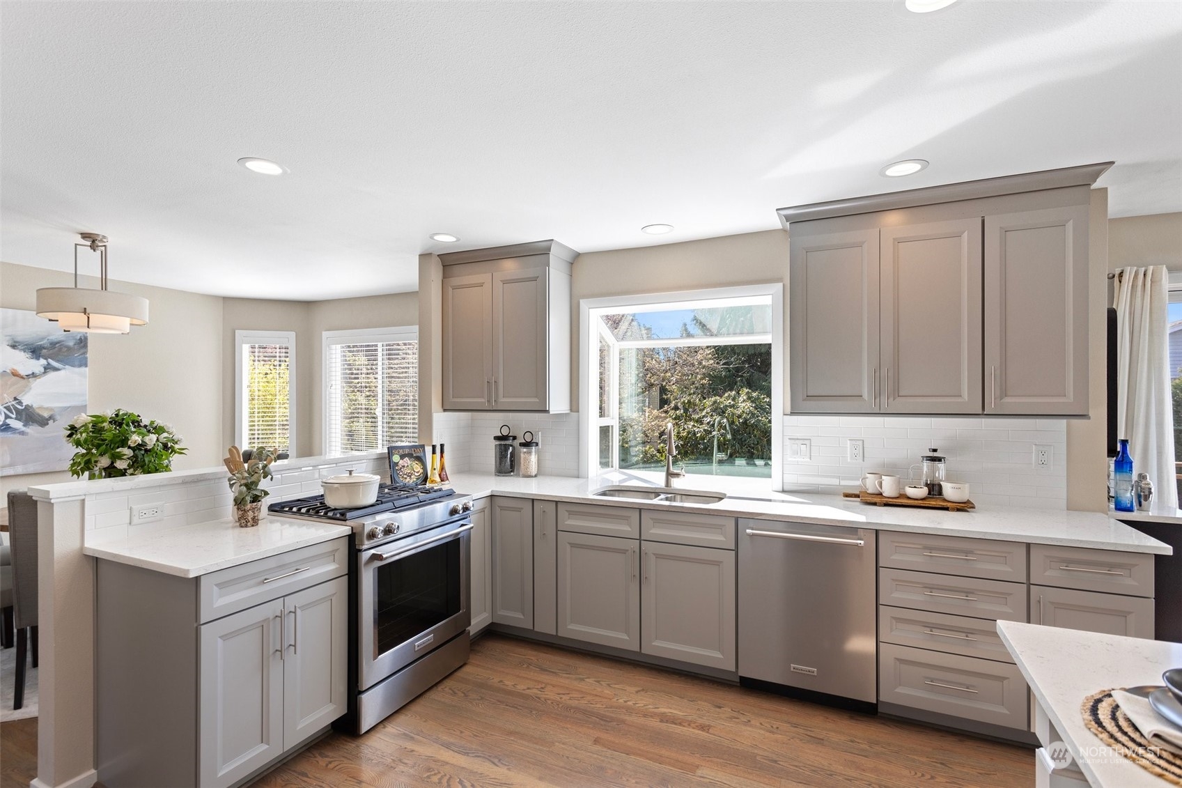 112 236th Place Southwest Bothell, WA 98021 - Photo 9 of 40 a kitchen with a sink stove and cabinets