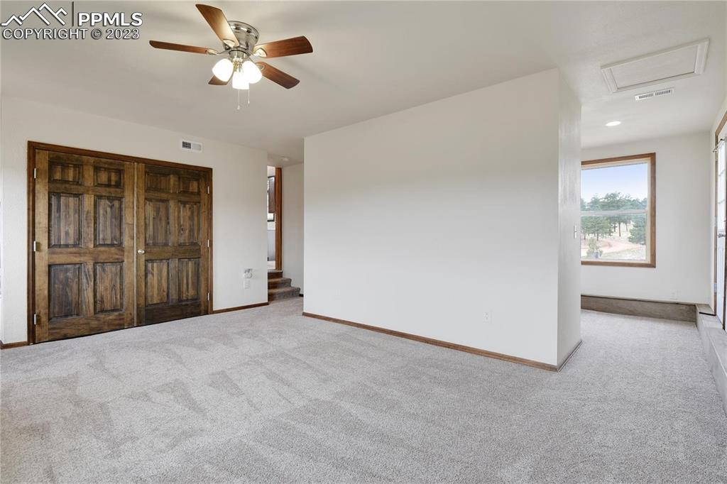 13771 South Hedi Road Sedalia, CO 80135 - Photo 11 of 49 a view of empty room with ceiling fan